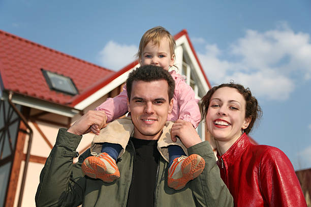 istock family with baby and house 2 92250366