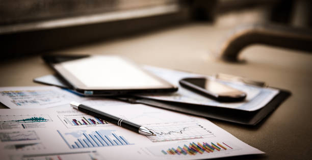 istock business documents with charts growth, keyboard and pen 922505904