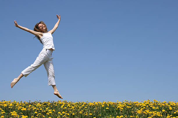 istock Pretty girl dancing in flowering meadow 92250801
