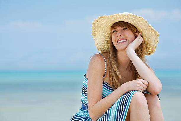 istock Beautiful young woman smiling on the beach 92251485