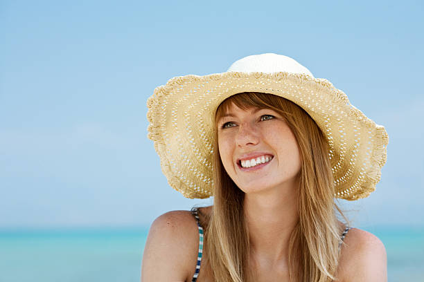 istock Beautiful young woman smiling on the beach 92251487