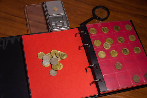 istock Page of numismatics album with different coins isolated. 922522864