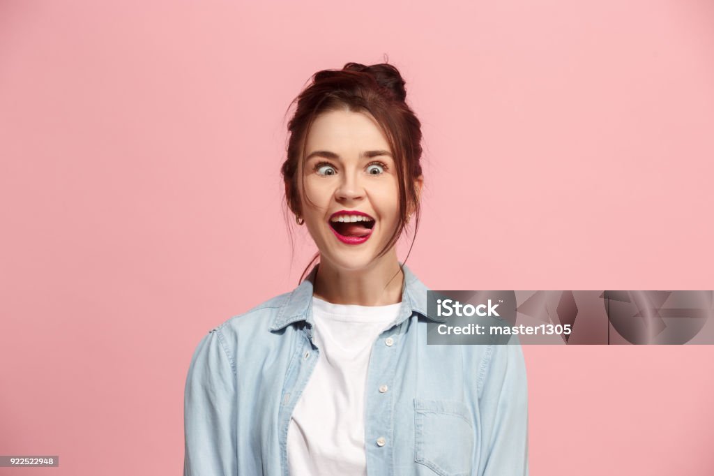 The squint eyed woman with weird expression isolated on pink I lost my mind. The squint eyed woman with weird expression. Beautiful female half-length portrait isolated on pink studio backgroud. The crazy woman. The human emotions, facial expression concept. Women Stock Photo