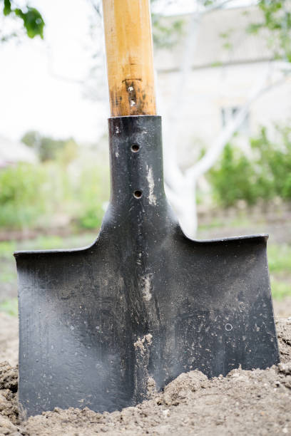 istock Black shovel in the ground 922525832