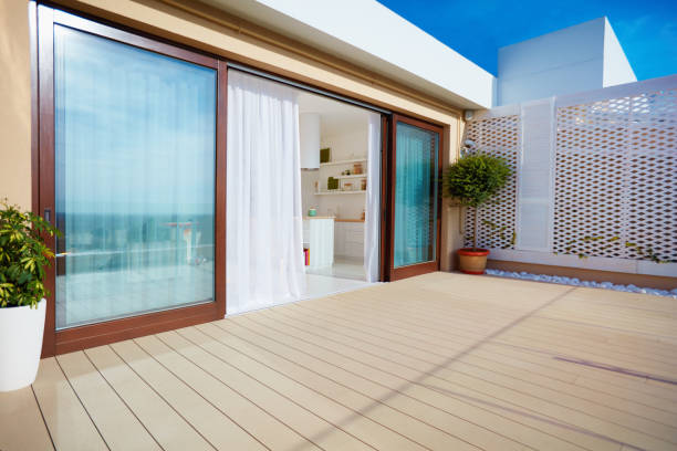 istock roof top patio with open space kitchen, sliding doors and decking on upper floor 922526934