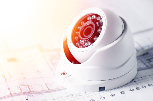istock Video security equipment and blueprint on a table. Good for security service engineering company site or advertising 922527034