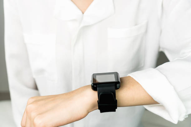 istock Woman using a digital clock in the display and technology advances in communication. This is a new technology. That makes life more comfortable. 922527238