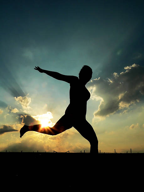 istock Woman Running, against sunset 92252966