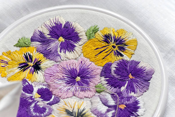 Embroidery with pansy pattern stock photo