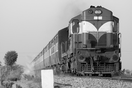 Indian locomotive on the track - black and white image.