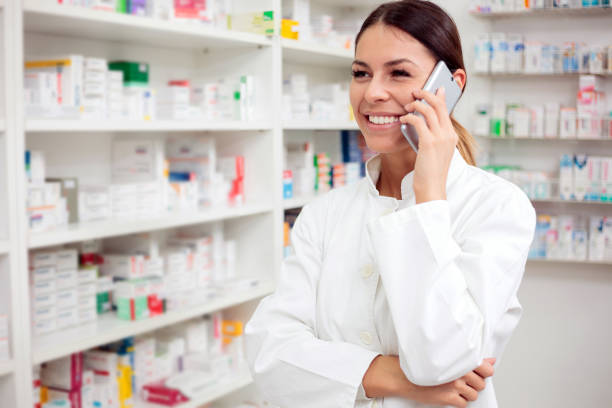 istock Beautiful young pharmacist talking on the phone 922532652