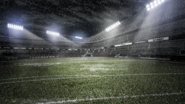 istock rainy soccer stadium in light rays at night 3d illustration 922533978