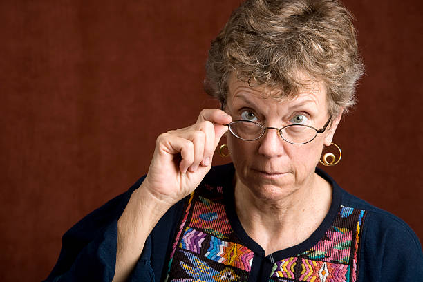 istock Woman looking over her glasses 92253699