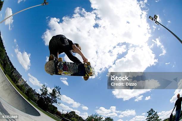 Shot Of A Skateboard Trick Catching Air Stock Photo - Download Image Now - Skateboarding, Pain, Ball Bearing