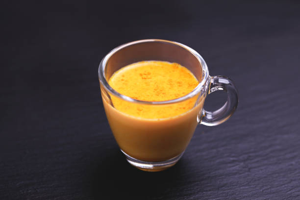 istock Indian turmeric milk with saffron, cardamom and turmeric. Copyspace 922539010