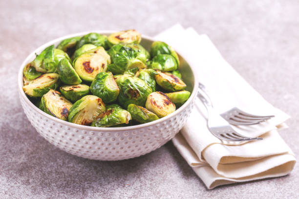 istock Vegetarian cuisine. Brussels Sprouts roasted with olive oil. Copyspace 922539274