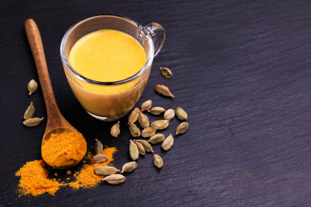 istock Indian turmeric milk with saffron, cardamom and turmeric. Copyspace 922539714