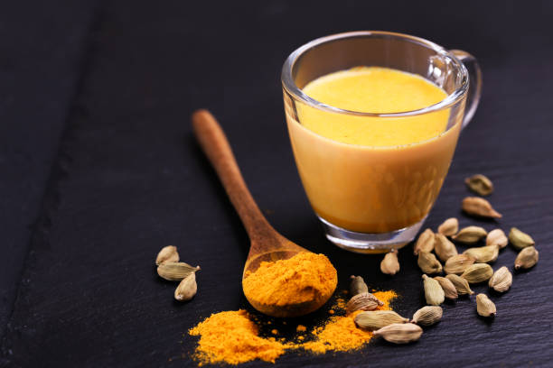istock Indian turmeric milk with saffron, cardamom and turmeric. Copyspace 922539788