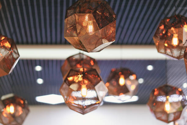 istock Industrial pendant lamps against rough wall. Loft interior. Edison bulbs. 922542410