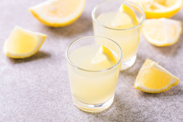 istock Italian lemon lime liqueur limoncello with ice and mint 922542574