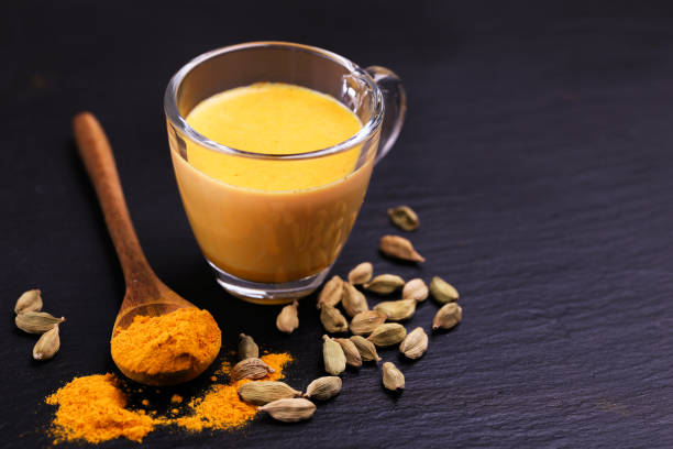 istock Indian turmeric milk with saffron, cardamom and turmeric. Copyspace 922542698