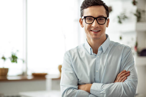 istock Alert worker standing with his arms crossed 922542954