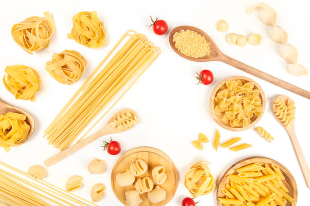istock Overhead photo of different types of pasta on white, forming frame 922544086