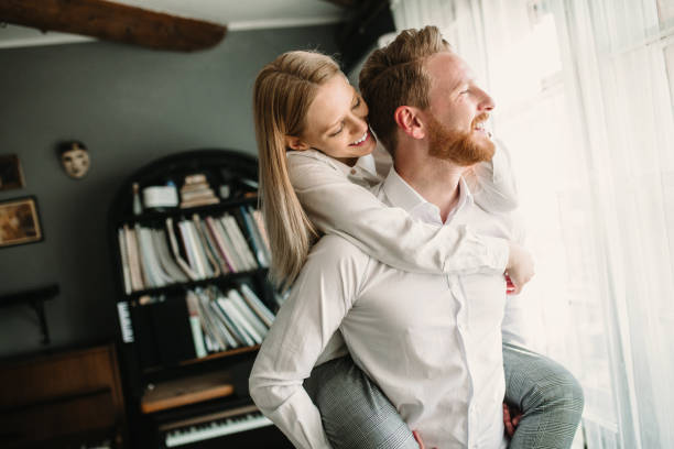 istock Young romantic couple in love hugging 922547422