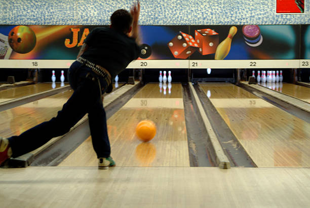 bowling with orange ball stock photo