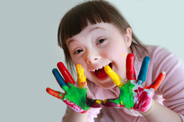 istock Cute little girl with painted hands. Isolated on grey background. 922548608