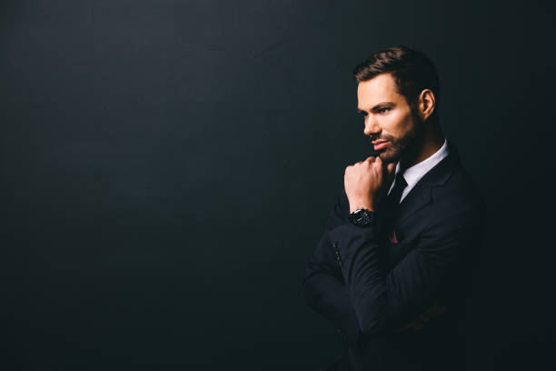 istock Young stylish businessman holding his chin 922548622