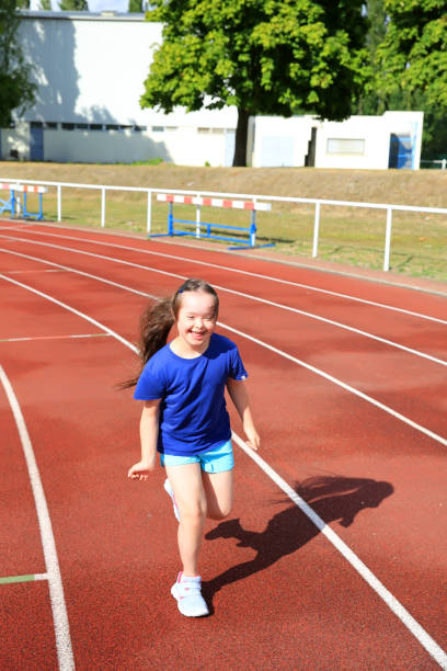 istock Little girl have fun on the stadium 922551052