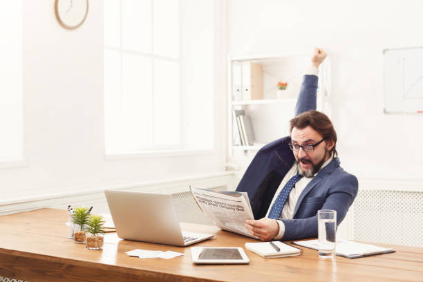 istock Happy businessman win. Winner, black man in office 922552644