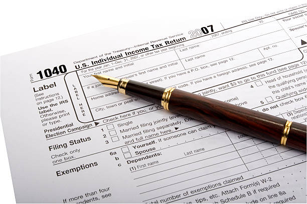 US 1040 Tax Form with Fountain Pen stock photo