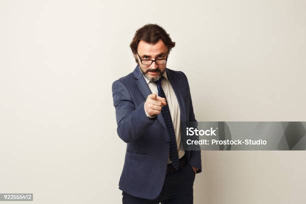 Confident Businessman Point At Camera Stock Photo - Download Image Now - Pointing, Camera - Photographic Equipment, Aiming