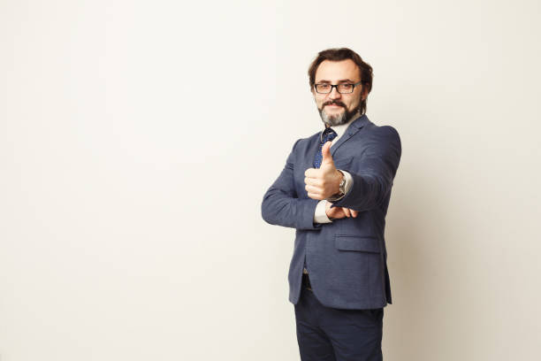 istock Confident businessman with thumb up portrait 922555474