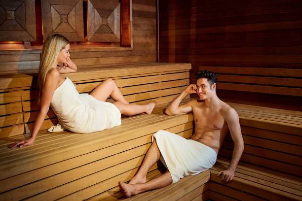 istock Couple in towels resting in the sauna 922555782