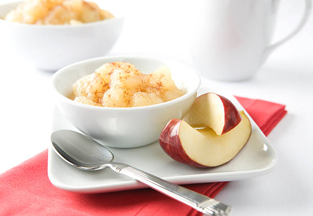 Bowl of Apple Sauce and Slices with Coffee Mug
