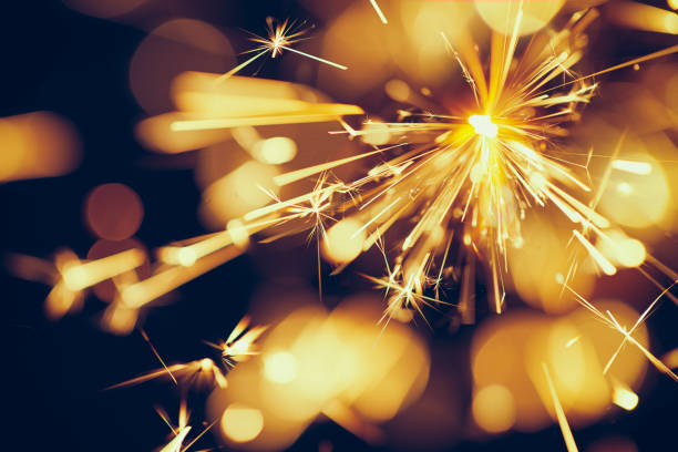 istock Abstract Sparks - Sparkler Background Party New Year Celebration Technology 922559012