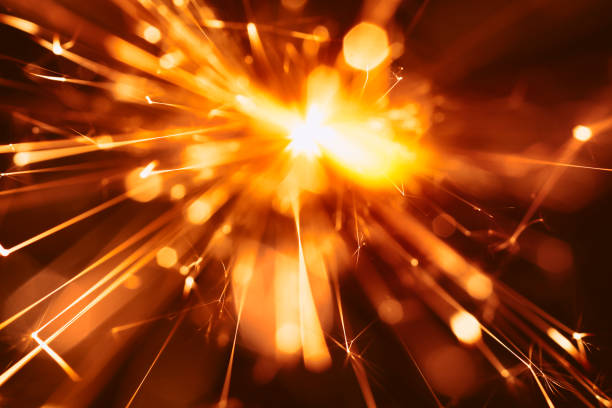 istock Abstract Red Sparks - Sparkler Background Party New Year Celebration Technology 922561064