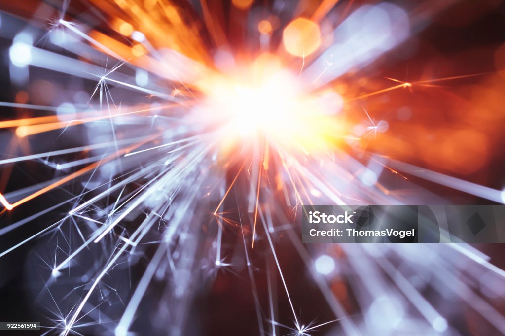 Abstract Yellow Blue Sparks Tunnel - Sparkler Background Party New Year Celebration Technology Macro photography of sparks. Great background image for party, celebration or technology. Sparks Stock Photo