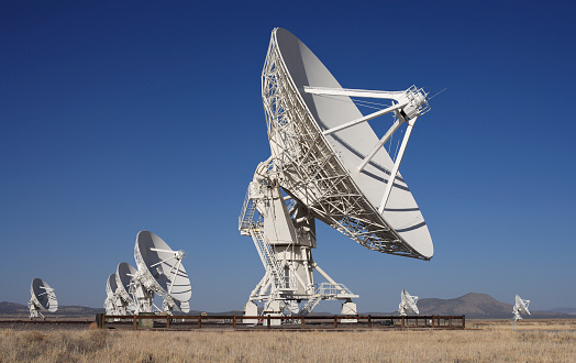 Late afternoon view of giant radio telescopes.