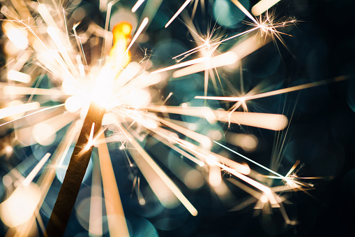 Sparkler on defocused Blue Background