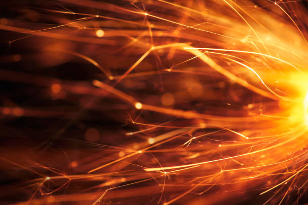 Low Angle View Of Sparks Against Sky At Night