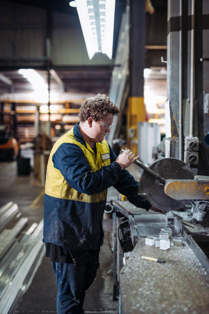 istock Experienced metal worker in factory, working on drill 922562054