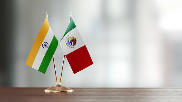 istock Mexican And Indian Flag Pair On A Desk Over Defocused Background 922562056