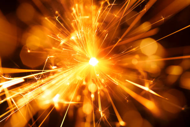 Abstract Centered Red Sparks - Sparkler Background Party New Year Celebration Technology stock photo