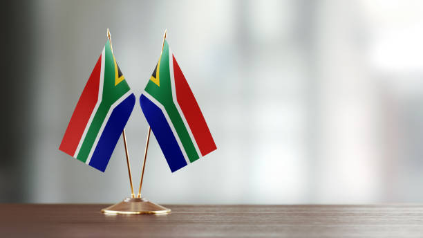 istock South African Flag Pair On A Desk Over Defocused Background 922565022