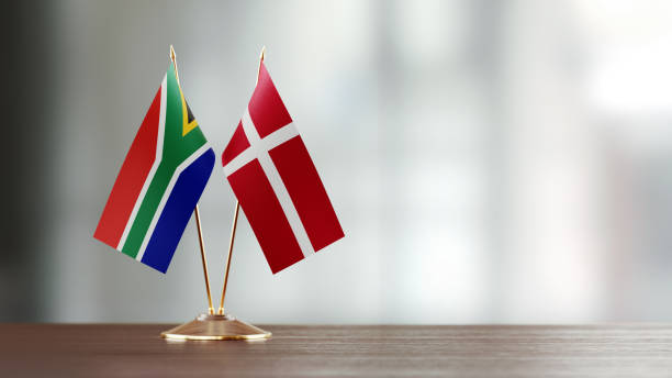 istock South African And Danish Flag Pair On A Desk Over Defocused Background 922565168