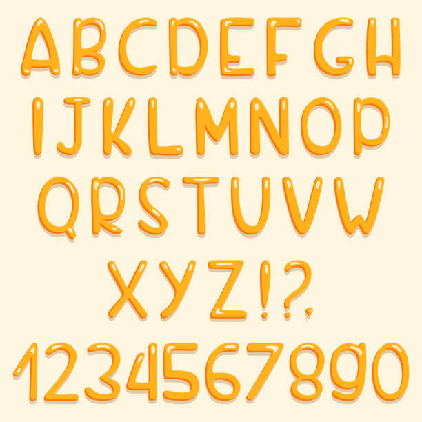 istock Glossy font design. Yellow ABC letters and numbers. Set of cartoon letters 922565290